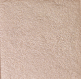 Highlighter-Puder in einem warmen, leicht bronzefarbenen Ton, ebenfalls mit einer feinen, schimmernden Struktur.